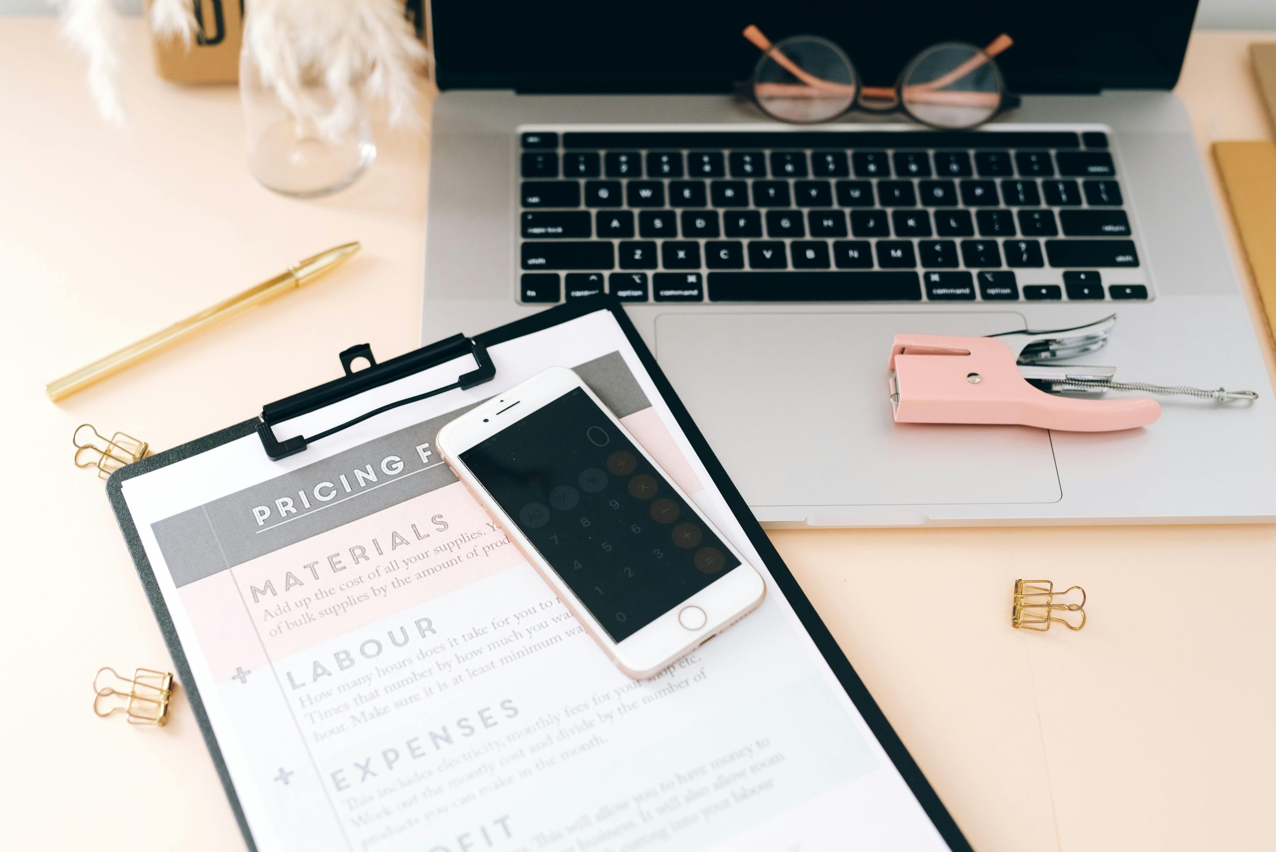 Illustration of a business owner calculating rates, emphasizing the importance of pricing your services accurately.
